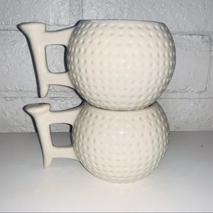 Two golf ball mugs with with tee handle